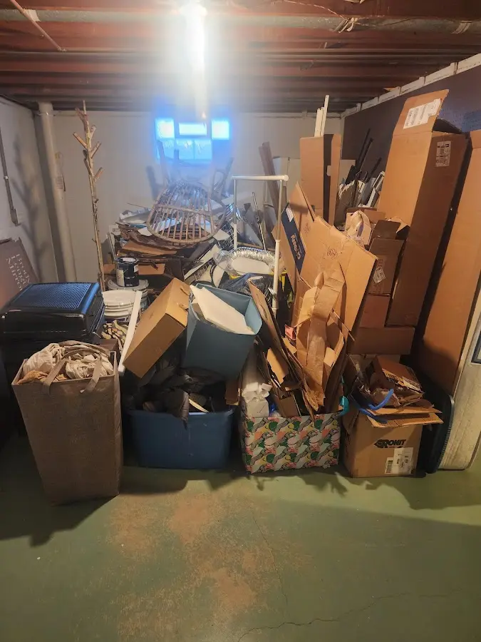 Roll-off dumpster container at job site for 2 Yard Dumpster Rental in Montpelier