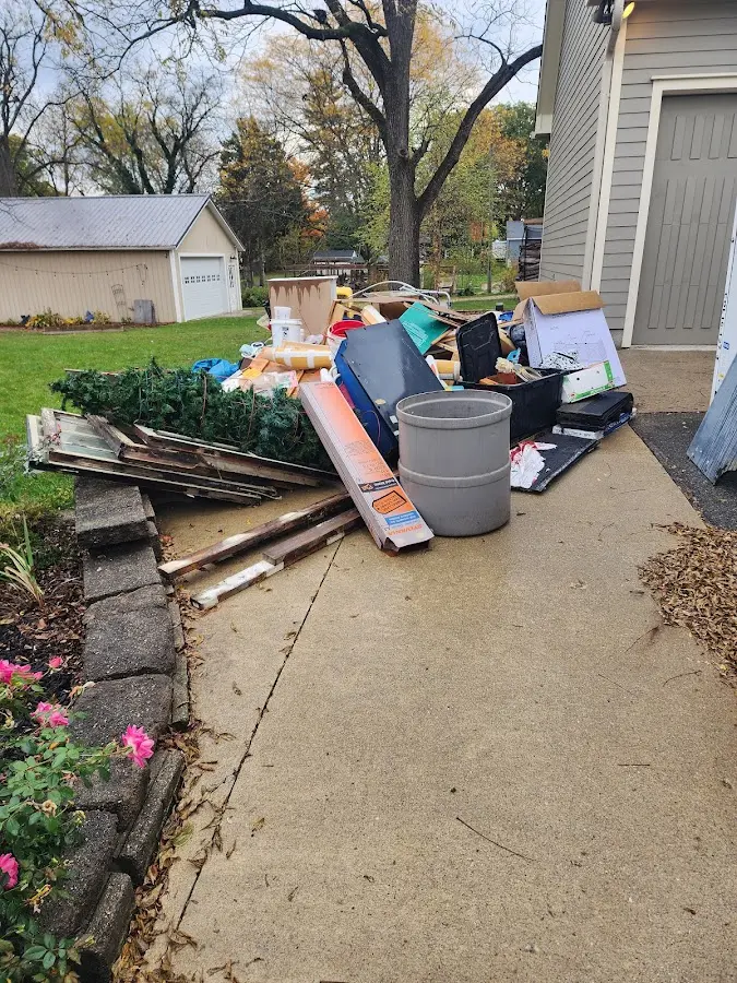 Dumpster being loaded with debris for 30 Yard Dumpster Rental in Montpelier